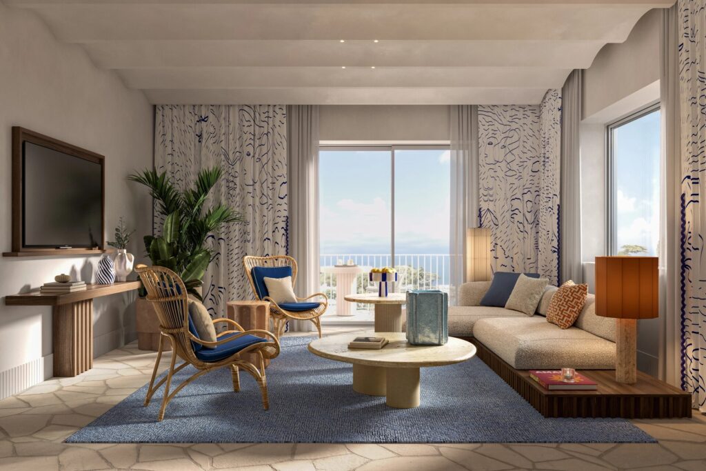 Suite living room with a sea view window, Capri Palace Jumeirah
