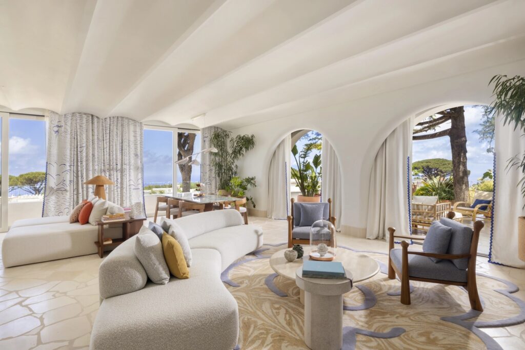 White arched lounge with garden view, Capri Palace Jumeirah