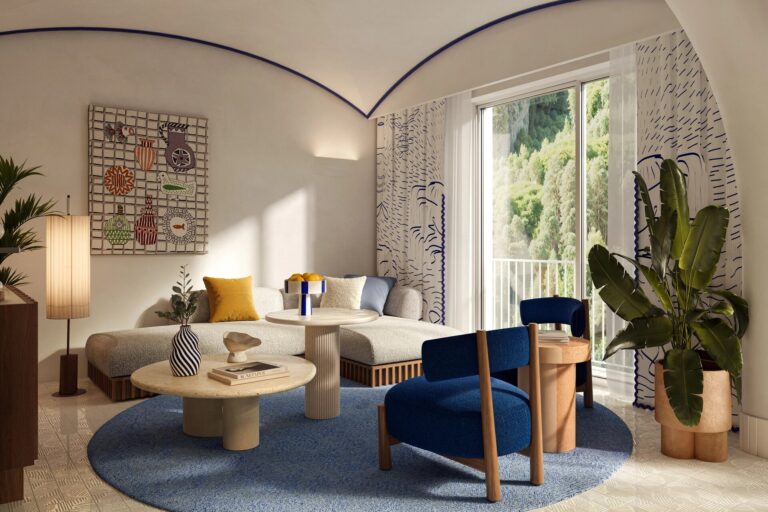 Lounge with blue armchairs and a window onto the garden, Capri Palace Jumeirah