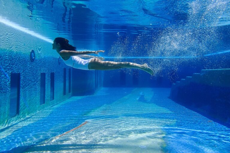 Swimmer in the indoor pool, Capri Palace Jumeirah