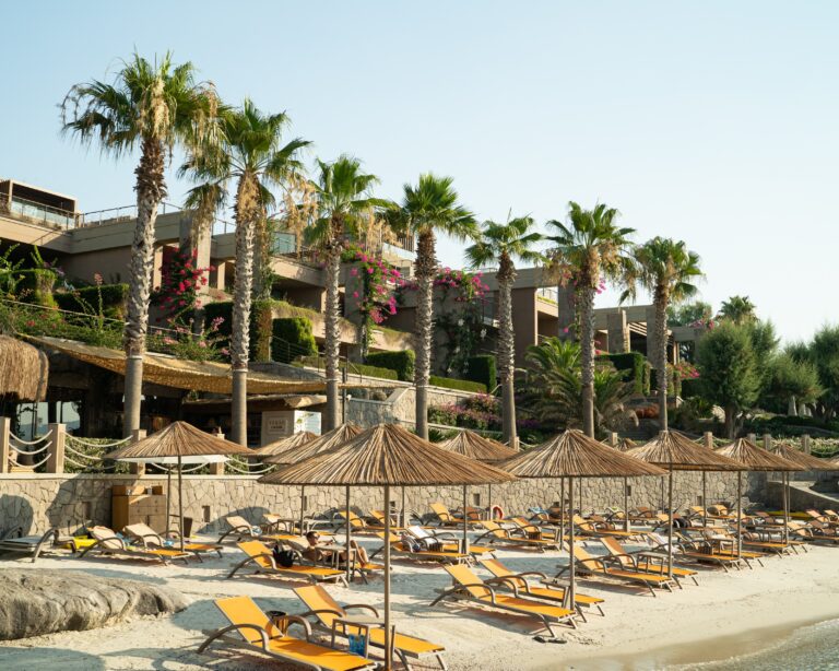 Sun loungers and parasols on the beach, Caresse, a Luxury Collection Resort and Spa, Bodrum