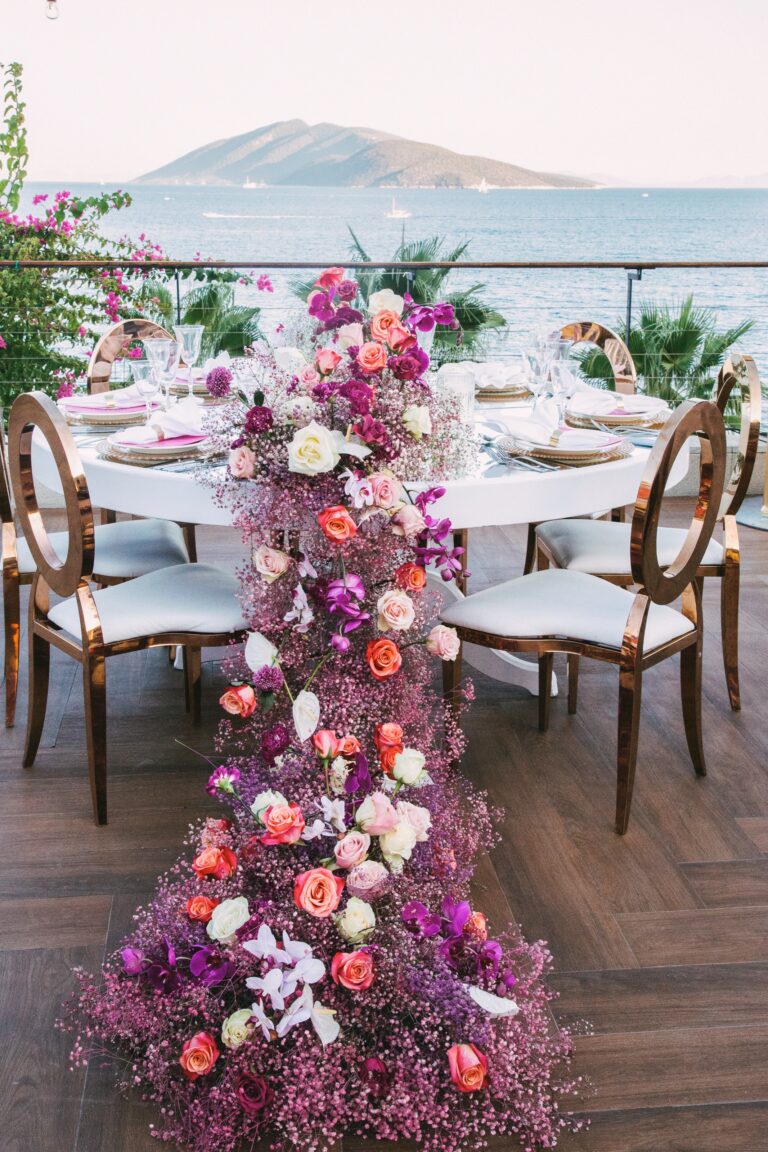 Dinner table with floral runner on the terrace, Caresse, a Luxury Collection Resort and Spa, Bodrum