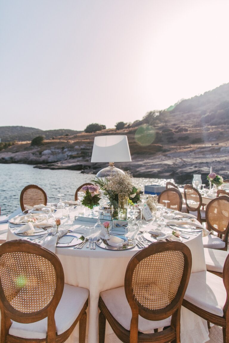 Round tables set for dinner by the sea, Caresse, a Luxury Collection Resort and Spa, Bodrum