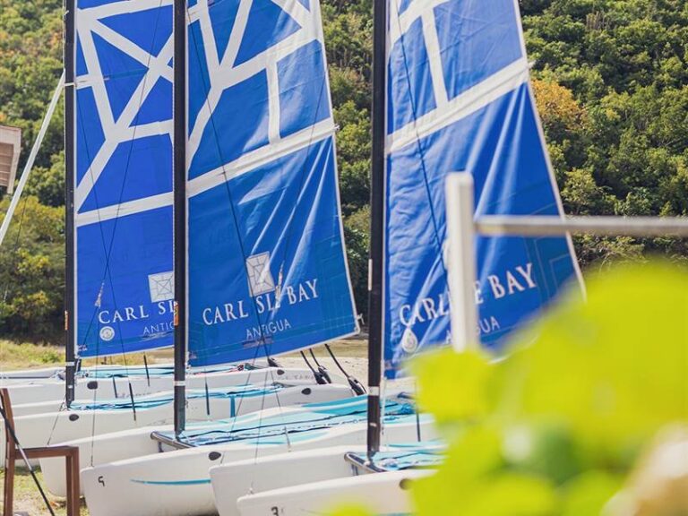 Sailing catamarans with the resort name on the sails, Carlisle Bay Antigua