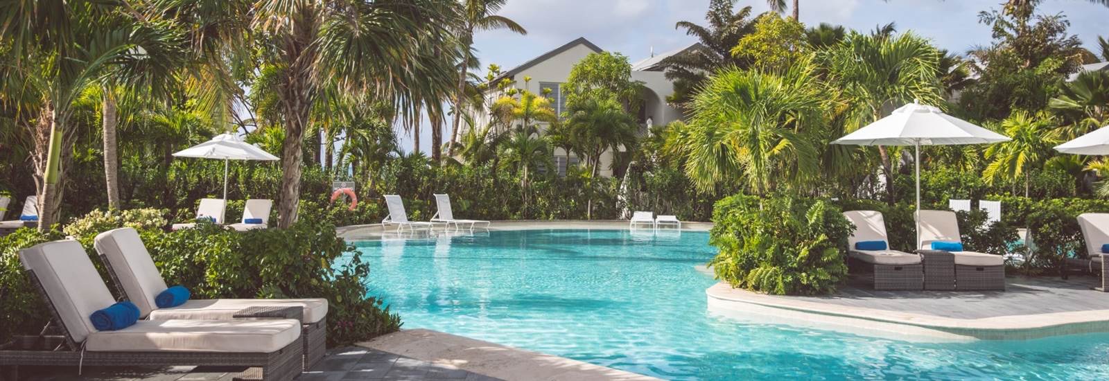 The pool and sun loungers beside the beach, Carlisle Bay Antigua