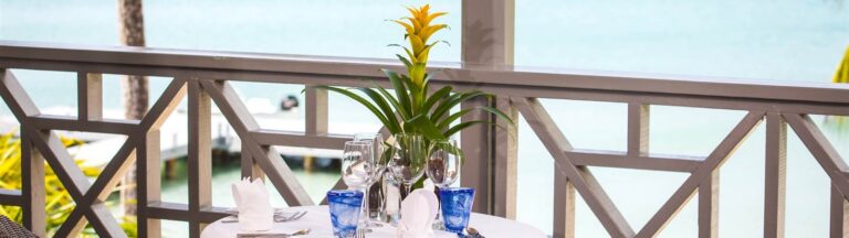 Balcony table set with flowers, Carlisle Bay Antigua
