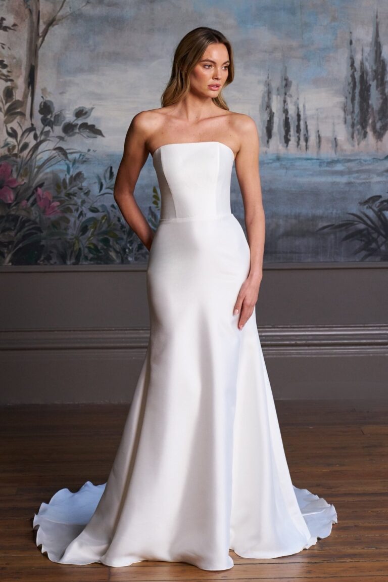 The Aurora Rose strapless gown against a painted backdrop, Caroline Castigliano