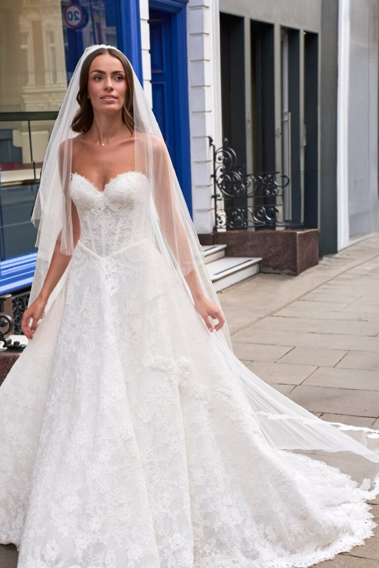 The It's a Love Story lace gown with a veil, Fleur d'Amour collection, Caroline Castigliano