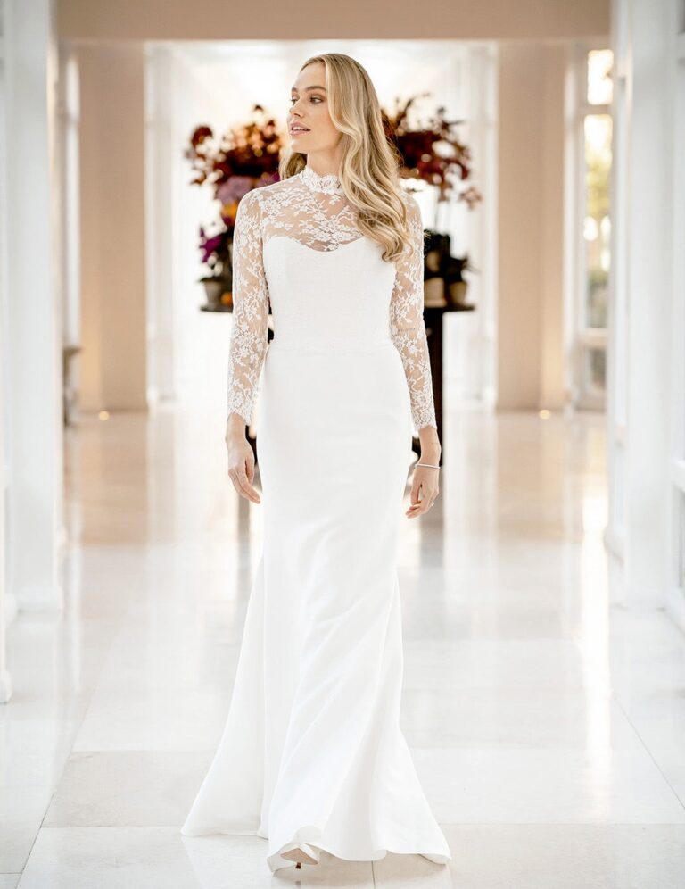 The Statue gown from the Icon collection in a white marble hall, Caroline Castigliano
