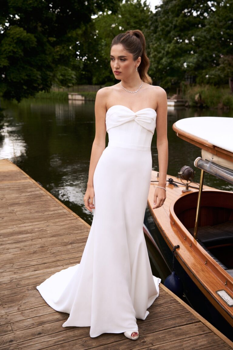 The Moonlight Serenade gown on a river jetty, Caroline Castigliano