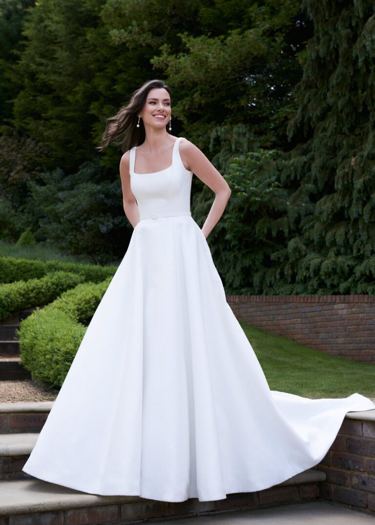 The Eden gown on garden steps, Celebration collection, Caroline Castigliano