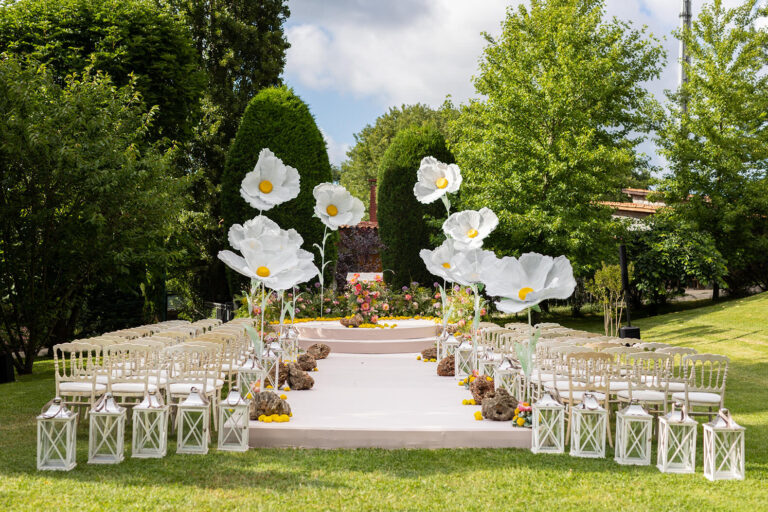 Lawn ceremony with a central aisle and white flower installations, Casa Lavanda