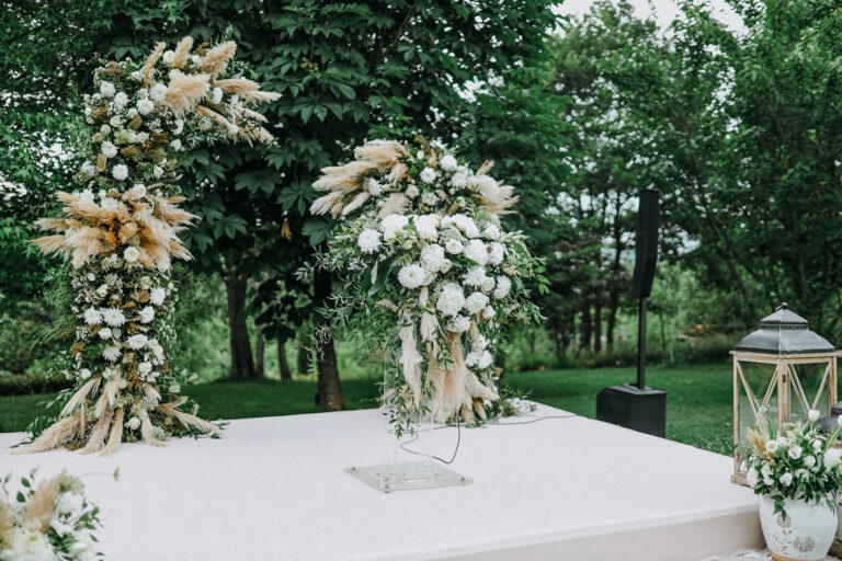 Floral arrangements at a ceremony set among the trees, Casa Lavanda