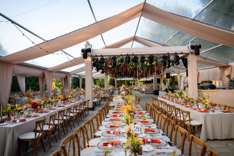 Reception tables set under a clear-roofed marquee, Casa Lavanda