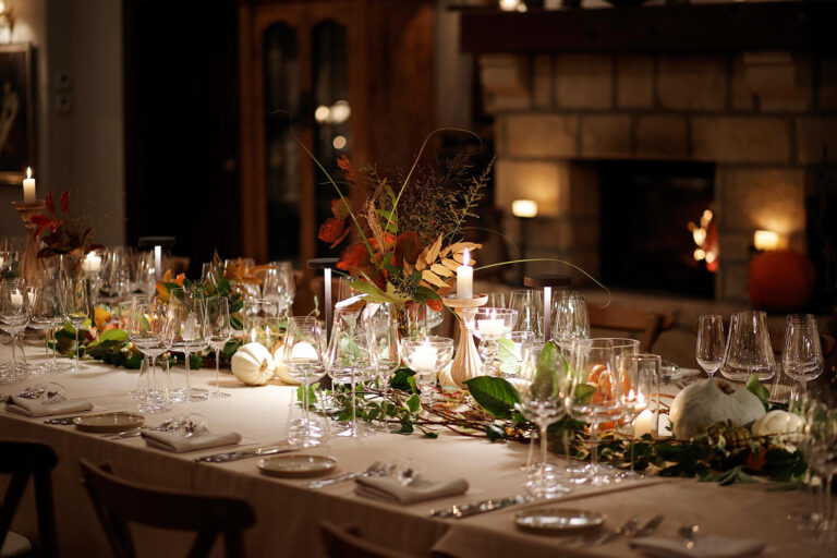 Table laid for dinner beside the stone fireplace, Casa Lavanda