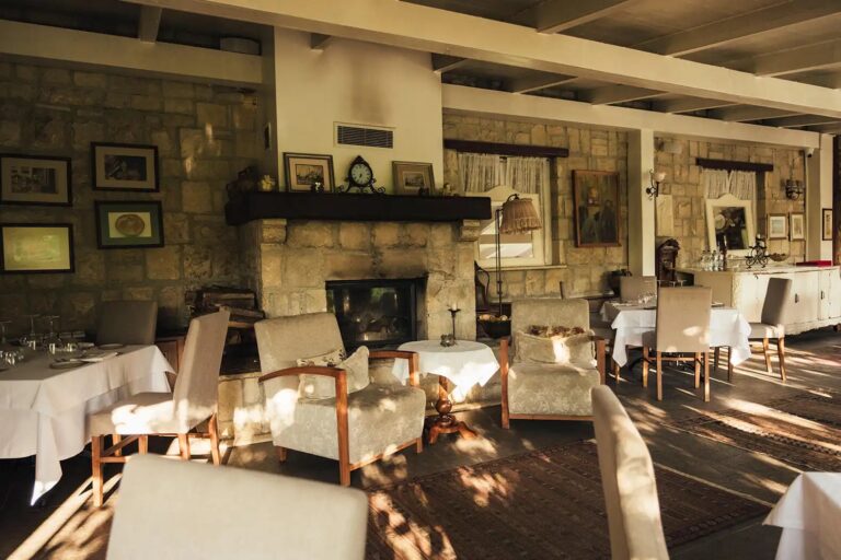 The restaurant dining room with its stone fireplace, Casa Lavanda