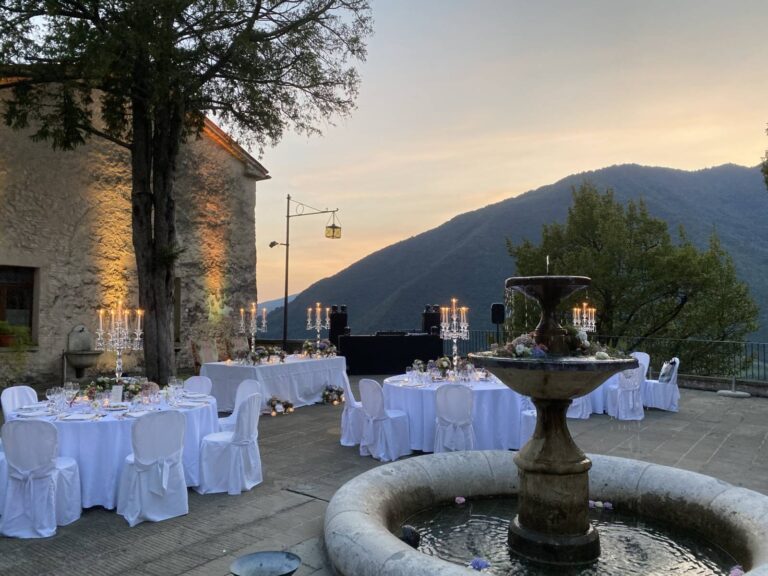Tables set by the fountain, Castel Brando