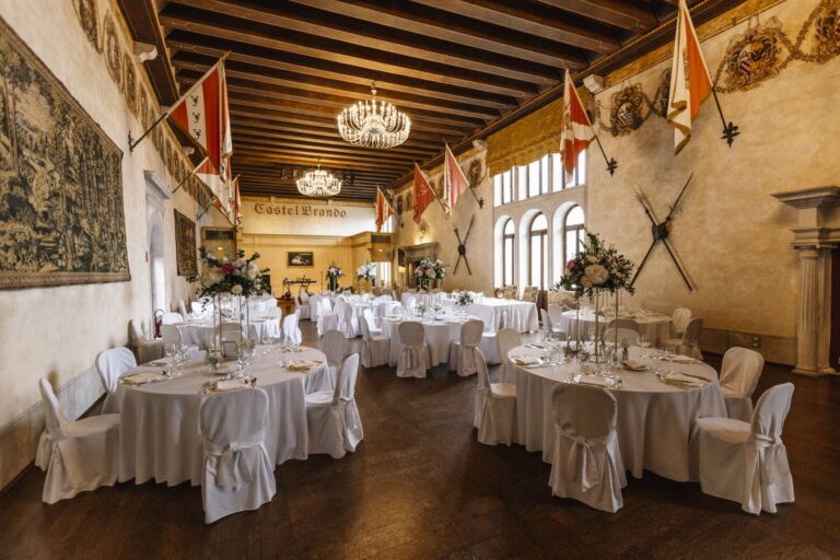 The great hall set for a wedding dinner, Castel Brando