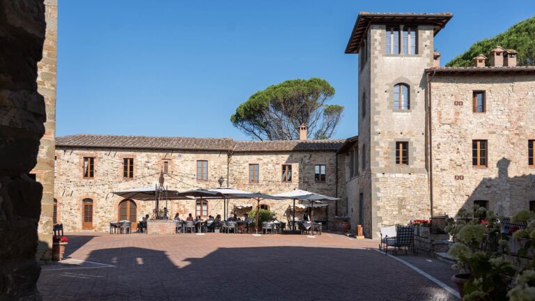 The piazza and village buildings in sunshine, Castel Monastero