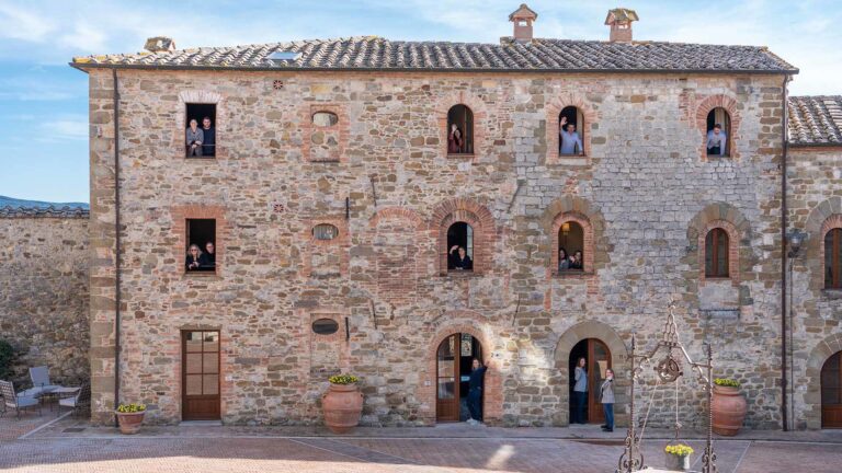 Stone facade of the village, Castel Monastero