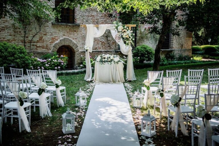 An outdoor ceremony in the castle gardens, Castello Bevilacqua