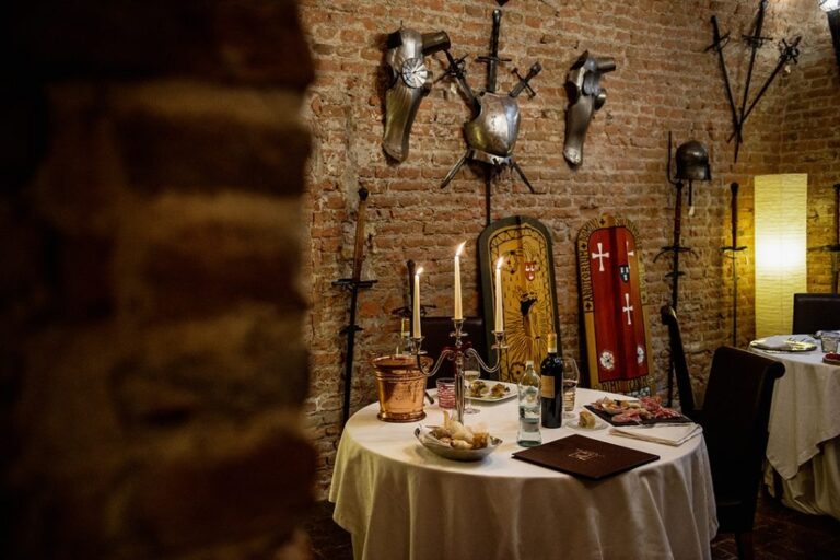 The candlelit dining salon at Castello Bevilacqua, Castello Bevilacqua