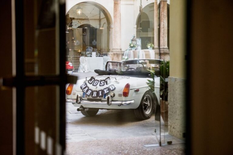 Arriving by vintage car through the castle gate, Castello Bevilacqua