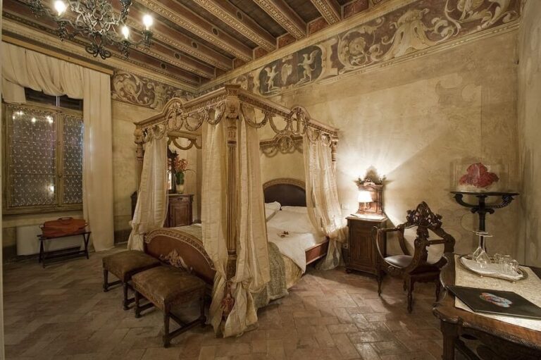 A four-poster suite with baroque furnishings, Castello Bevilacqua