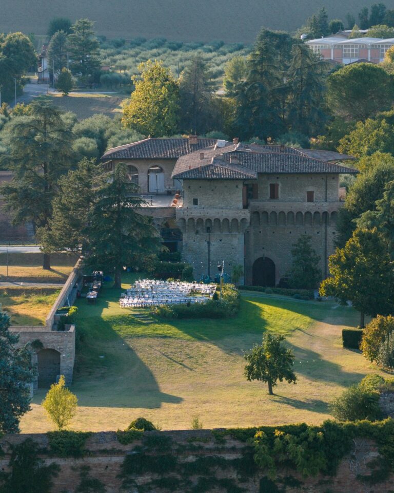 The castle from above, with chairs set out for a ceremony on the lawn, Castello del Capitano delle Artiglierie