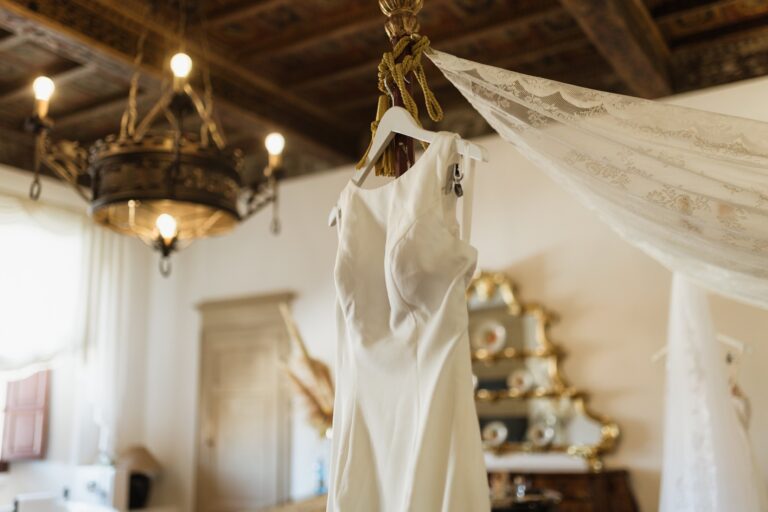 A wedding dress hanging in a suite, Castello del Capitano delle Artiglierie