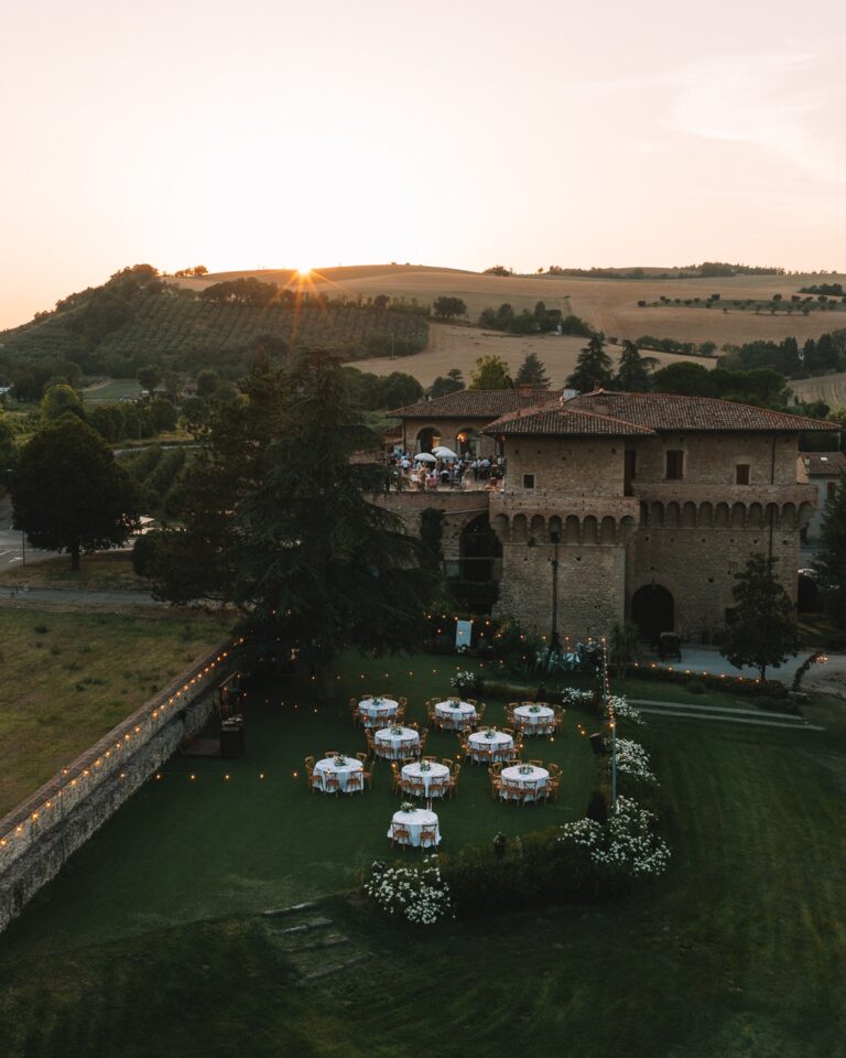 Tables on the lawn below the castle at dusk, seen from above, Castello del Capitano delle Artiglierie