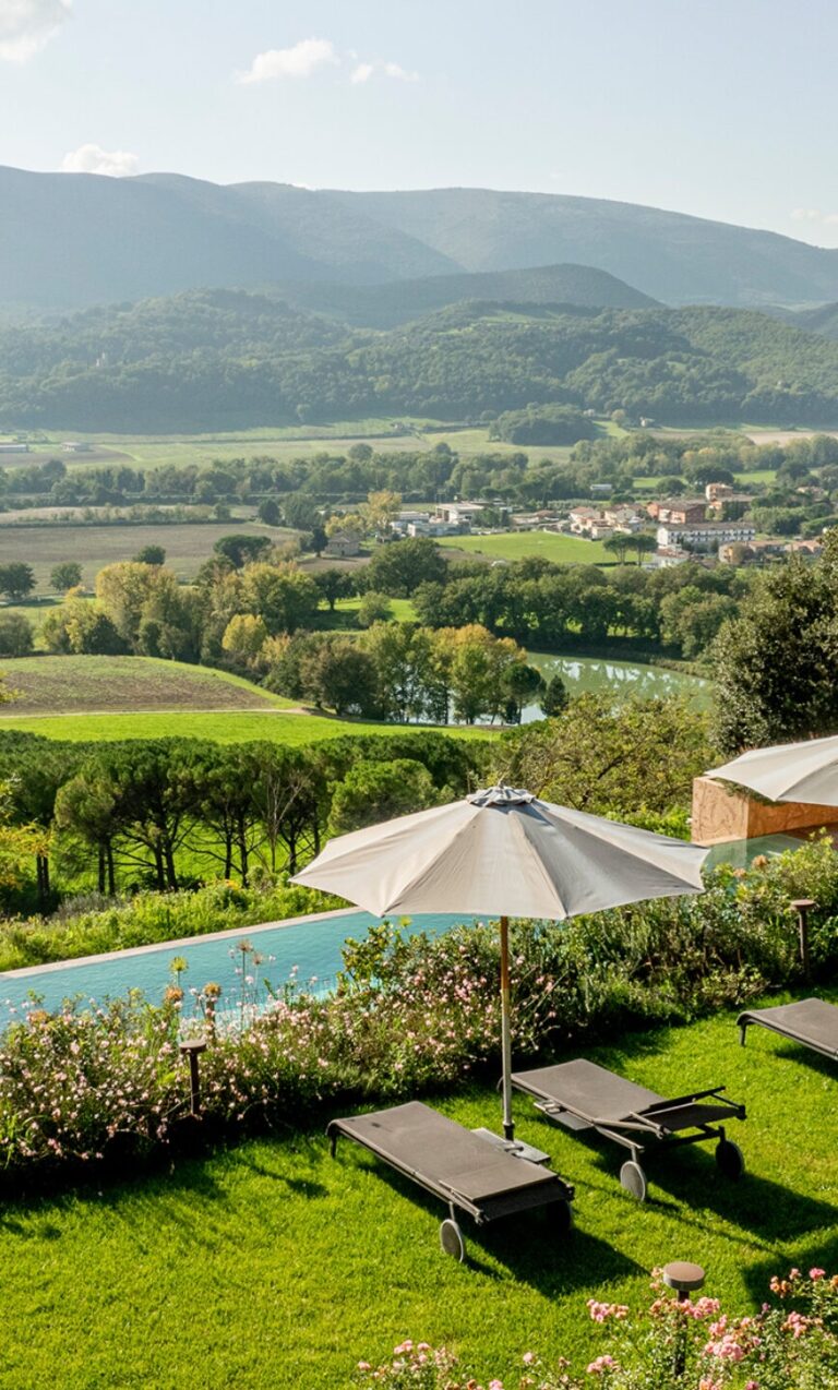 The outdoor pool with sun loungers and panoramic Umbrian valley views, Castello di Solfagnano