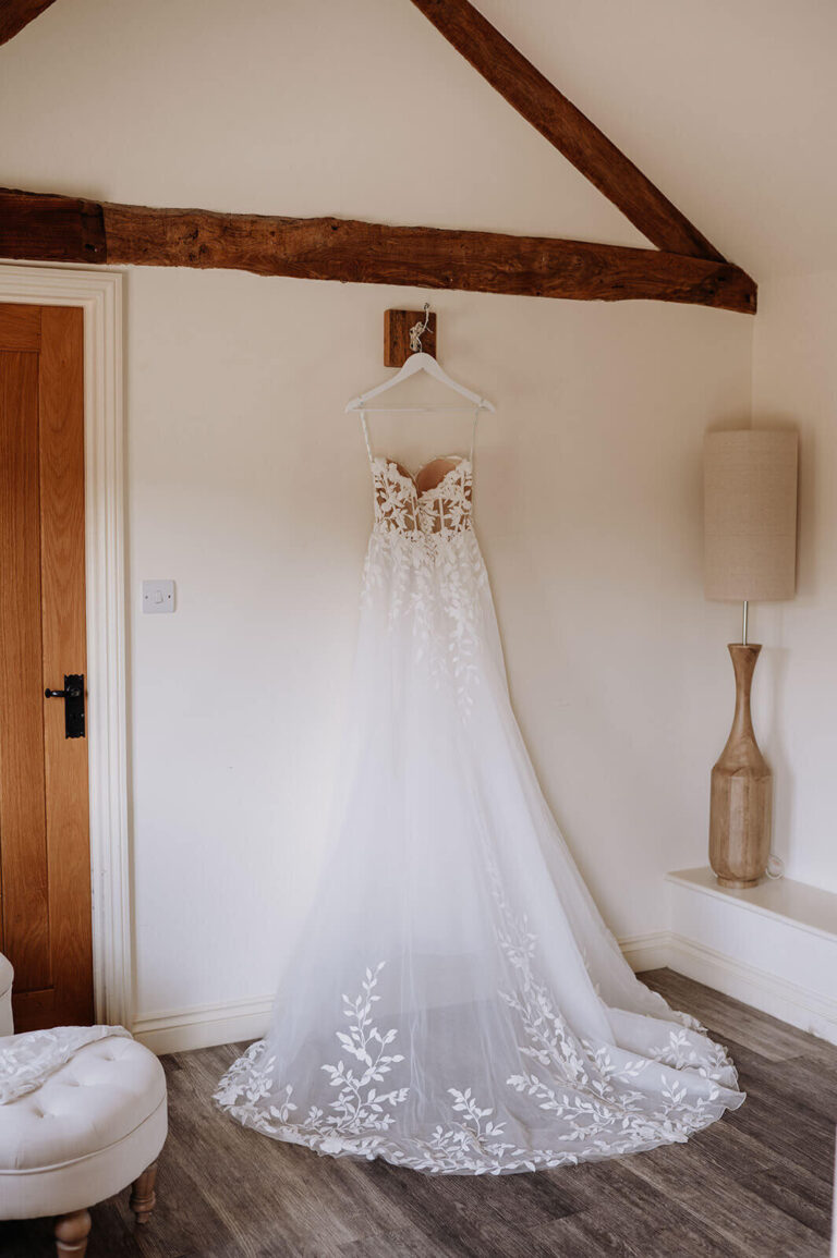 A wedding dress hanging in the Dressing Room, one of the two preparation spaces, Caswell House