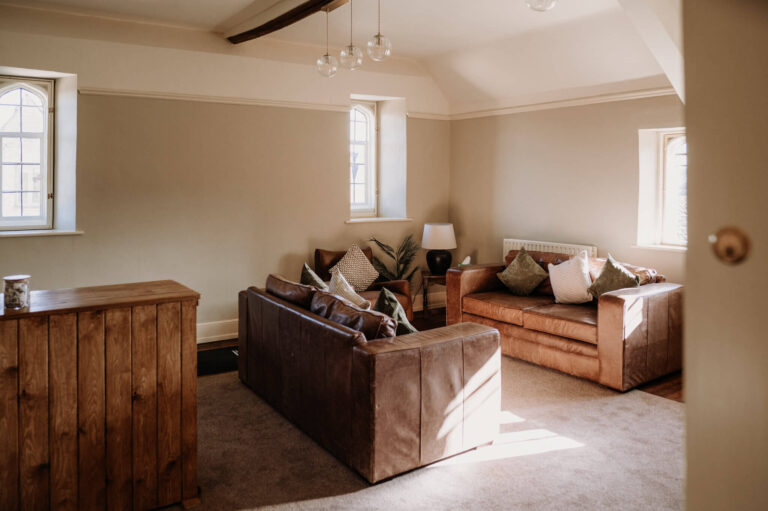 The Games Room, with leather sofas and a bar, used as the second preparation space, Caswell House