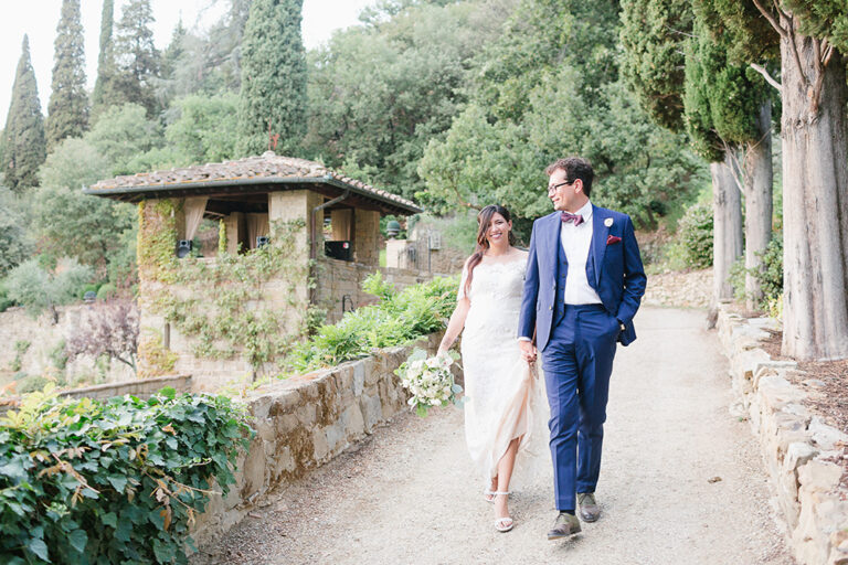 The couple walking through a terraced Florentine garden, Caterina Weddings