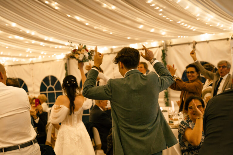 Guests dancing under the lights of the marquee, Château de Chéronne