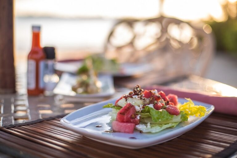 A gourmet plated salad, dining al fresco by the sea, Chabil Mar Resort