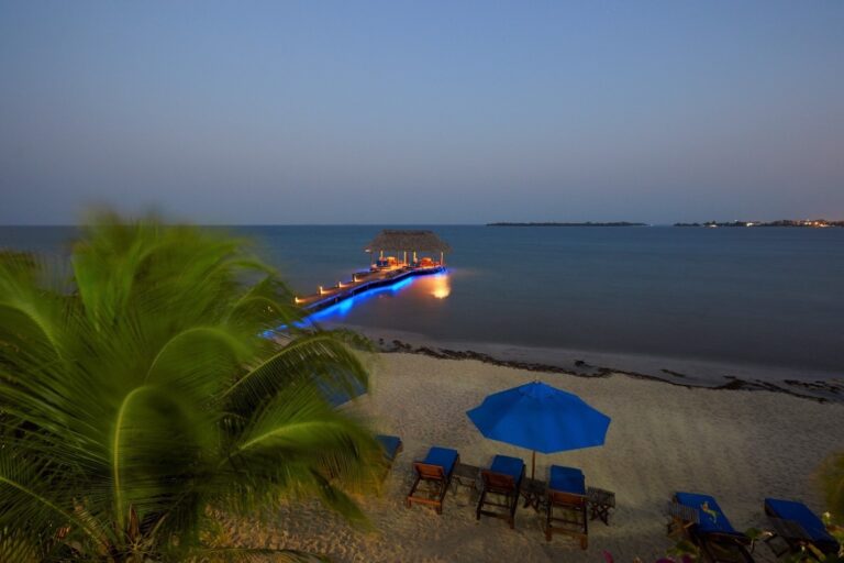 The pier stretching into the Caribbean at golden hour, Chabil Mar Resort