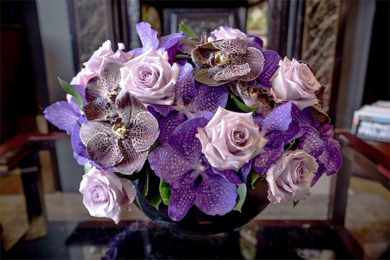 An arrangement of vanda orchids and lilac roses, Chantal Flores Design