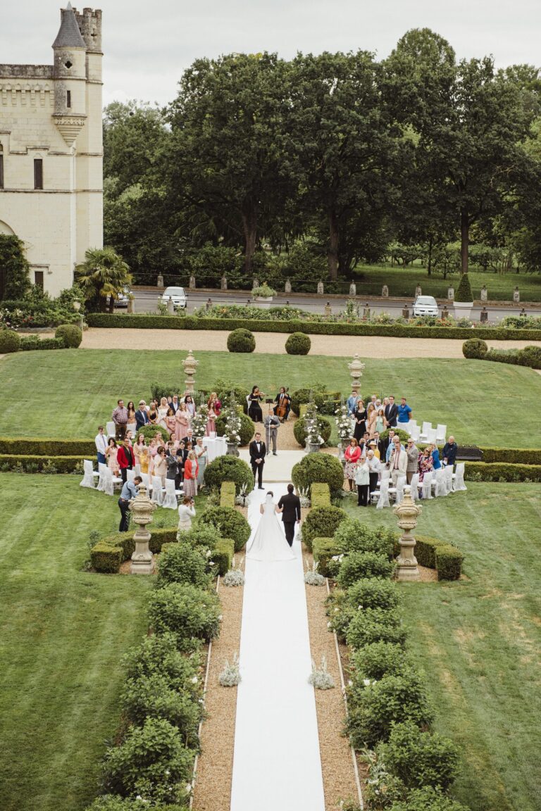 Guests seated along a garden aisle, Chateau Challain