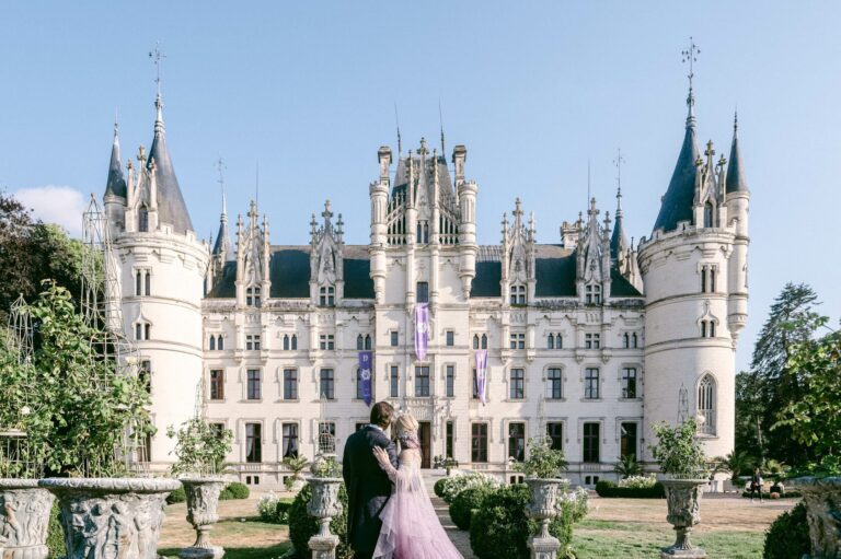 The chateau front with a couple on the garden terrace, Chateau Challain