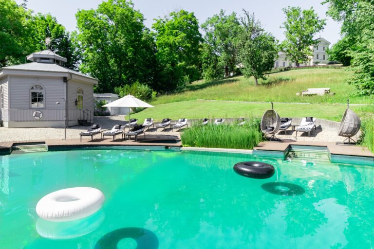 The natural swimming lake with sun loungers, Chateau Mcely