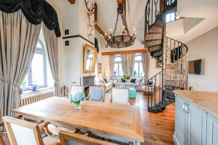 A suite with a gallery and spiral staircase, Chateau Mcely