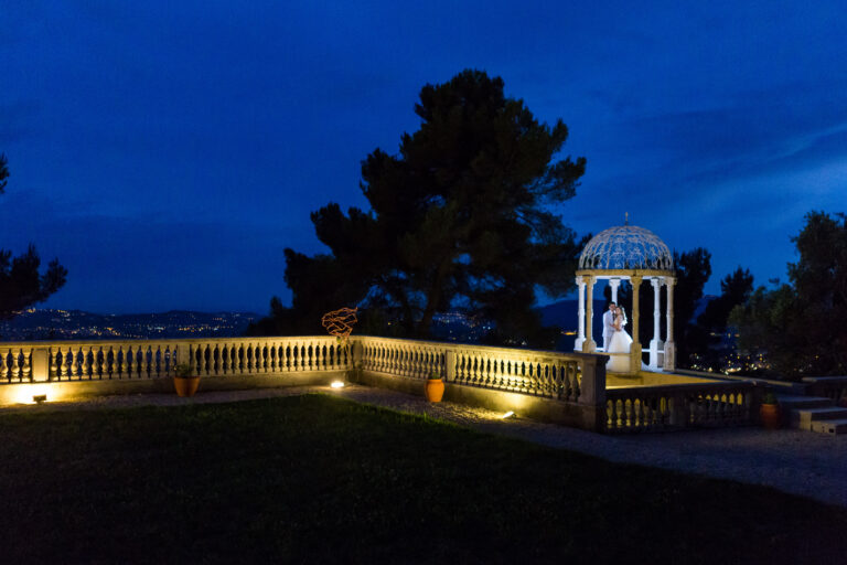 The Temple of Love lit at night across the lawn, Chateau Saint Georges