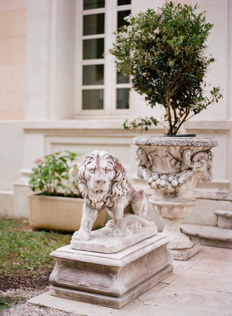 A stone lion on a terrace of the château, Chateau Saint Georges