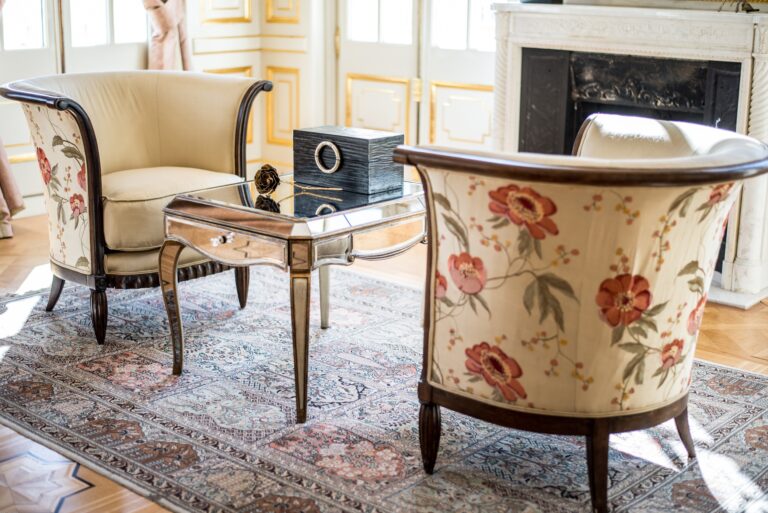 Armchairs and a low table in a bedroom sitting area, Chateau Saint Georges