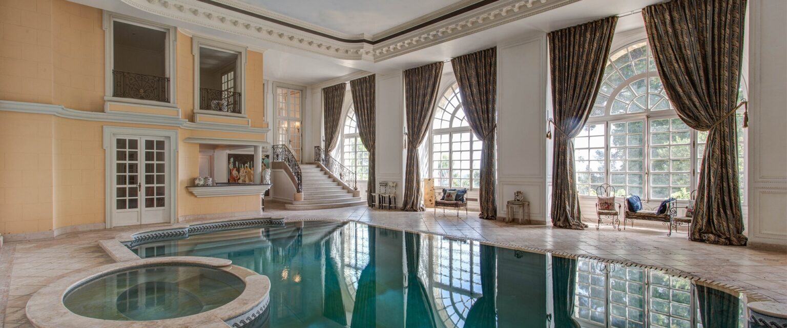 The indoor swimming pool hall with its arched windows
