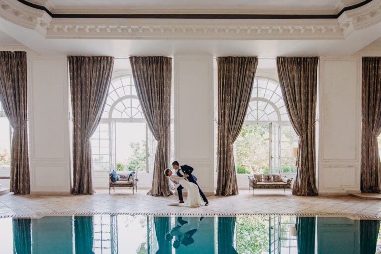 The indoor pool hall with tall windows and heavy curtains, Chateau Saint Georges