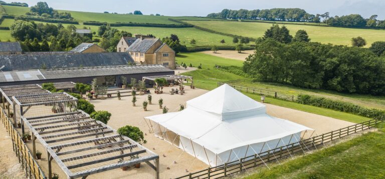 Aerial view of the estate with a marquee and pergolas, Chedington Grange
