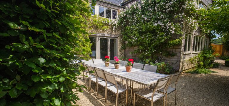 Courtyard terrace and dining table, Chedington Grange